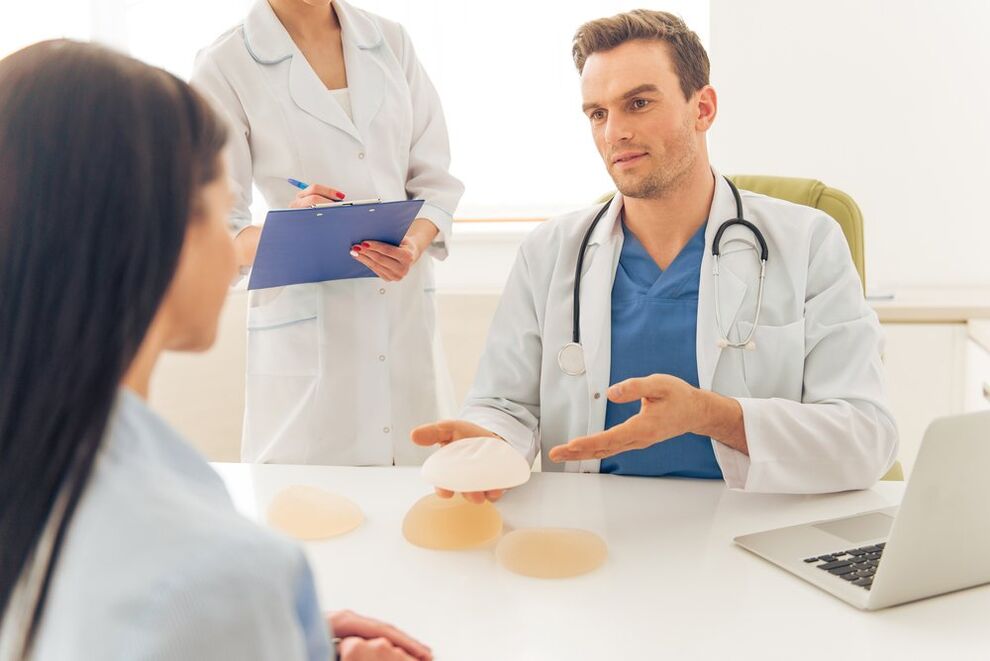 Doctor offering breast implants
