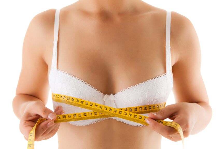 A girl measures her breasts and wants to increase the size