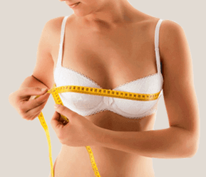 Girl uses centimeters to measure breast circumference